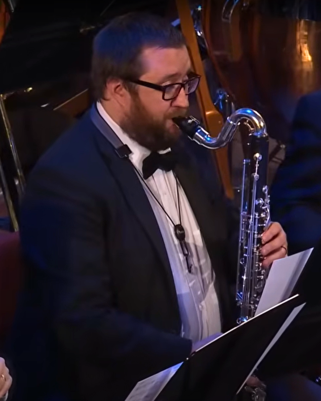 Jack Barton playing bass clarinet on a concert stage